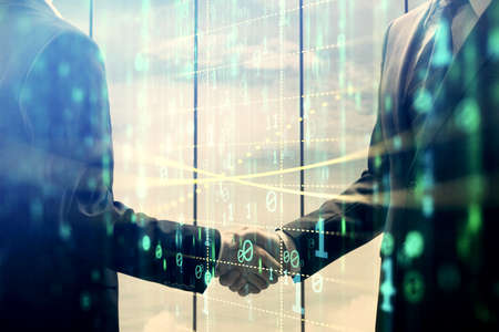 Double exposure of data theme hologram and handshake of two men. Partnership in IT industry concept.の写真素材
