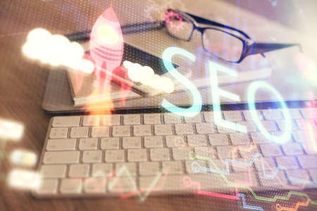 Double exposure of SEO drawing and cell phone background. Concept of data search optimizationの写真素材