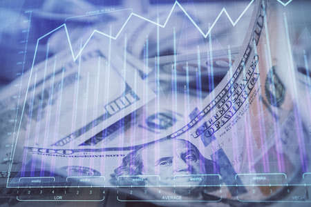 Double exposure of forex graph drawing over us dollars bill background. Concept of financial markets.の写真素材
