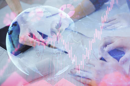 Double exposure of business theme drawing and man and woman working together holding and using a mobile device.の写真素材