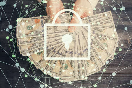 Double exposure of lock drawing hologram and us dollars bills and man hands. Security concept