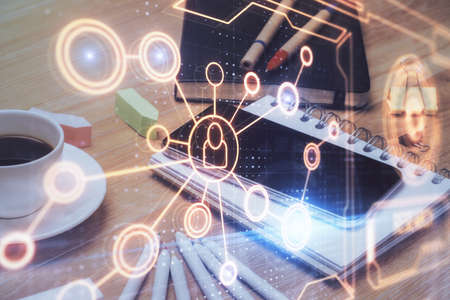 Double exposure of social network theme drawing and cell phone background. Concept of people...
