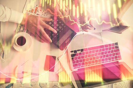 Double exposure of man and woman working together and financial chart hologram drawing. market...