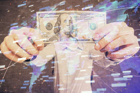 Double exposure of technology drawing hologram and us dollars bills and man hands. Data conceptの写真素材