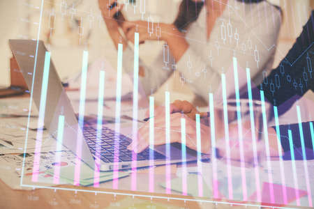 Multi exposure of woman hands typing on computer and forex chart hologram drawing. Stock market analysis concept.の写真素材