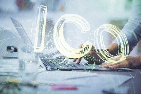 Double exposure of woman hands typing on computer and crypto market theme hologram drawing....