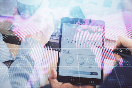 Double exposure of mans hands holding and using a phone and international business theme drawing.