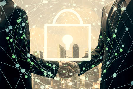 Double exposure of lock hologram and handshake of two men. Partnership security concept.