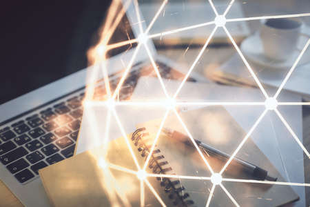 Double exposure of social network drawing and desktop with coffee and items on table background. Concept of international connection.の写真素材