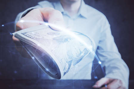 Multi exposure of social network theme drawing hologram and USA dollars bills and man hands.