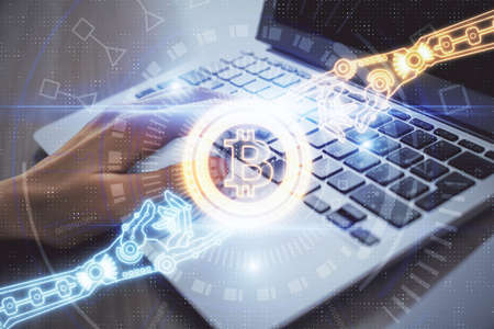 Double exposure of woman hands typing on computer and crypto market theme hologram drawing. Blockchain concept.の写真素材