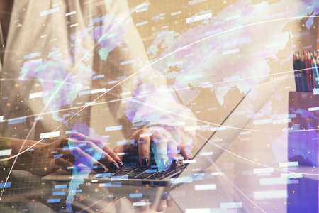 Double exposure of woman hands working on computer and data theme hologram drawing. Tech concept.