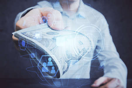 Multi exposure of social network theme drawing hologram and USA dollars bills and man hands.の写真素材