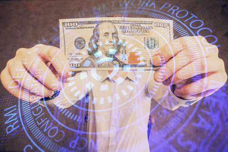 Double exposure of technology drawing hologram and us dollars bills and man hands. Data conceptの写真素材