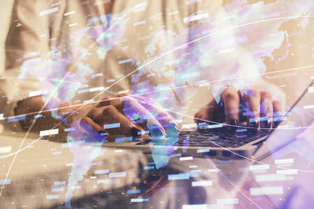 Double exposure of woman hands working on computer and data theme hologram drawing. Tech concept.