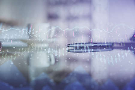 Double exposure of forex chart over coffee cup background in office. Concept of financial analysis...