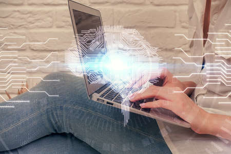 Multi exposure of woman hands working on computer and brain hologram drawing. Ai concept.