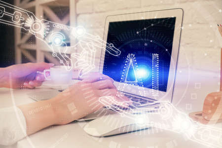 Double exposure of woman hands working on computer and data theme hologram drawing. Tech concept.