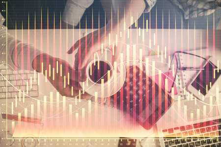 Double exposure of man and woman working together and financial chart hologram drawing. market...