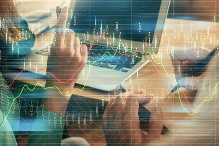 Double exposure of man and woman working together and forex chart hologram. Business concept. Computer background.の写真素材