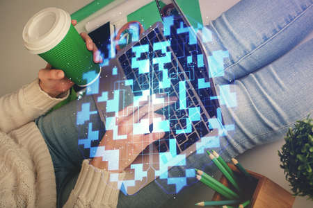 Double exposure of woman hands working on computer and data theme hologram drawing. Tech concept.