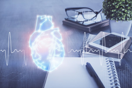 Double exposure of human heart drawing and cell phone background. Concept of medical educationの写真素材