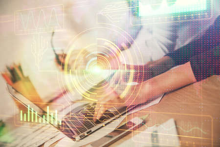 Double exposure of woman hands working on computer and data theme hologram drawing. Tech concept.