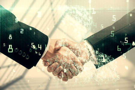 Double exposure of data theme hologram and handshake of two men. Partnership in IT industry concept.