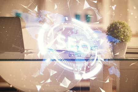 Double exposure of SEO drawing and office interior background. Concept of Search optimization engine.の写真素材