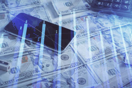 Double exposure of forex graph drawing over us dollars bill background. Concept of financial markets.の写真素材