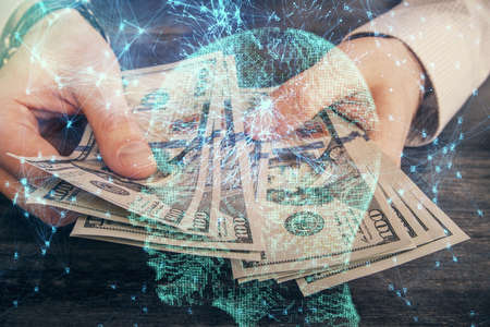 Multi exposure of brain drawing hologram and us dollars bills and man hands. Ai invest concept