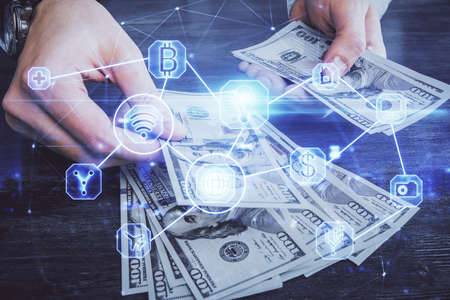 Multi exposure of social network theme drawing hologram and USA dollars bills and man hands.