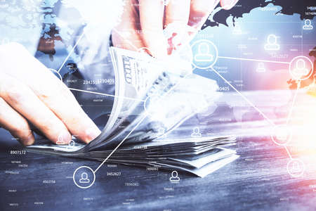 Multi exposure of social network theme drawing hologram and USA dollars bills and man hands.