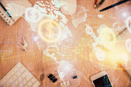 Multi exposure of forex graph hologram over desktop with phone. Top view. Mobile trade platform...
