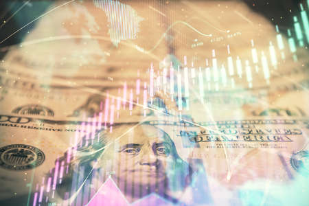 Double exposure of forex graph drawing over us dollars bill background. Concept of financial...