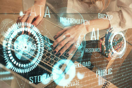 Double exposure of woman hands working on computer and data theme hologram drawing. Tech concept.