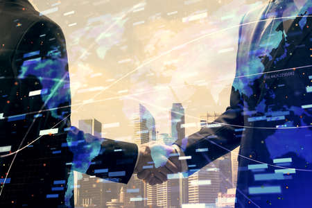 Double exposure of data theme hologram and handshake of two men. Partnership in IT industry concept.の写真素材
