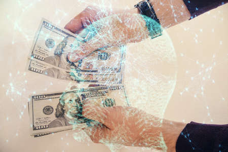 Multi exposure of brain drawing hologram and us dollars bills and man hands. Ai invest conceptの写真素材