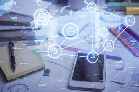 Double exposure of social network theme drawing and cell phone background. Concept of people...