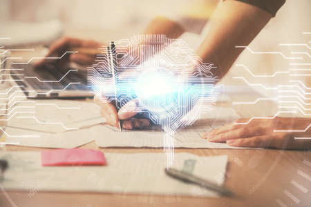 Multi exposure of woman hands working on computer and brain hologram drawing. Ai concept.の写真素材