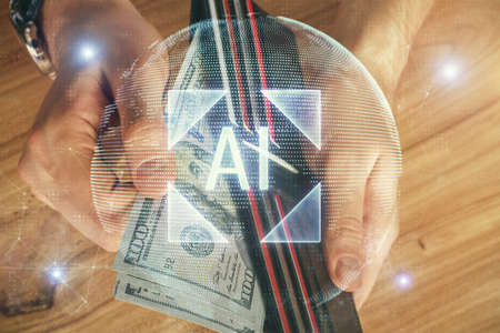 Double exposure of technology drawing hologram and us dollars bills and man hands. Data concept