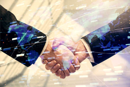 Double exposure of data theme hologram and handshake of two men. Partnership in IT industry concept.の写真素材