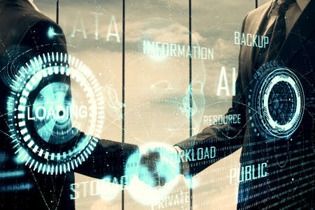 Double exposure of data theme hologram and handshake of two men. Partnership in IT industry concept.