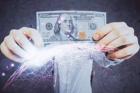Multi exposure of social network theme drawing hologram and USA dollars bills and man hands.の写真素材