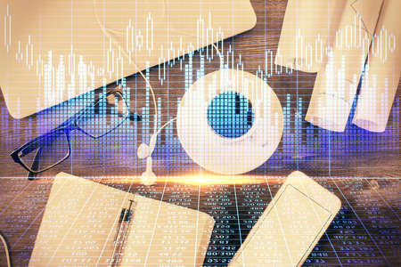 Multi exposure of forex graph drawing over desktop background with computer. Concept of financial...