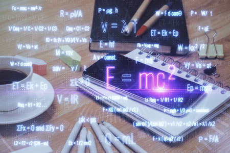 Double exposure of formula drawing and mobile phone background. Concept of education