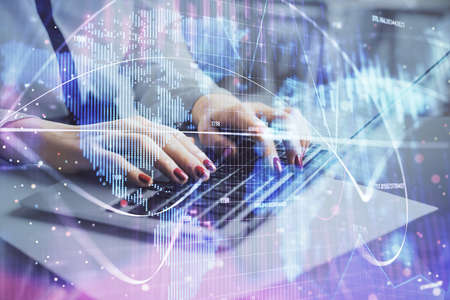Multi exposure of woman hands typing on computer and business theme hologram drawing. Success...