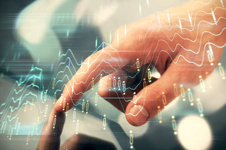 Multi exposure of mans hands holding and using a phone and financial chart drawing. Market analysis...