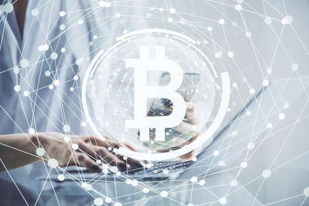 Double exposure of blockchain business sketch hologram and woman holding and using a mobile device.の写真素材
