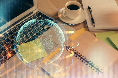 Double exposure of map drawing and desktop with coffee and items on table background. Concept of global data.の写真素材